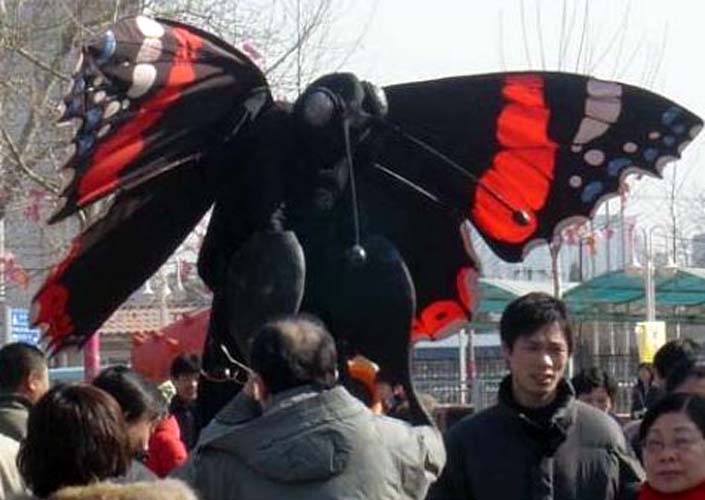 Giant Butterflies on stilts by Neighbourhood Watch Stilts International