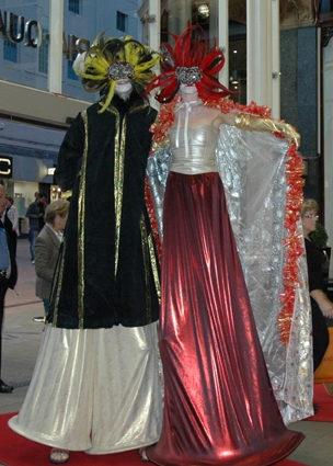 Masquerade Stilt walkers  by Rachel H