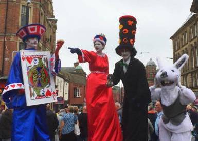 Knave of Hearts, Queen of Hearts, Mad Hatter Stilt walkers from Alice in Wonderland by Neighbourhood Watch Stilt walking international of Tyne & Wear