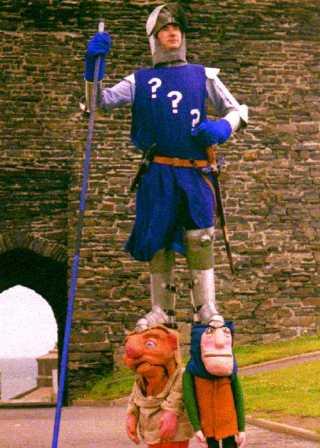 Sir Lupin of Pipwithers Kinight standing on his servants shoulders, by Tony Heales of Living Daylights from Aberystwith