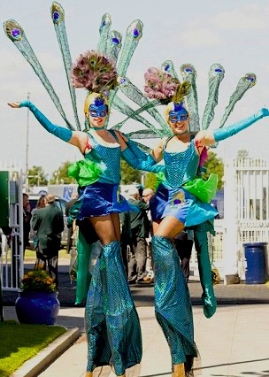 Peacocks on stilts by Vertigo Stilts from Bristol